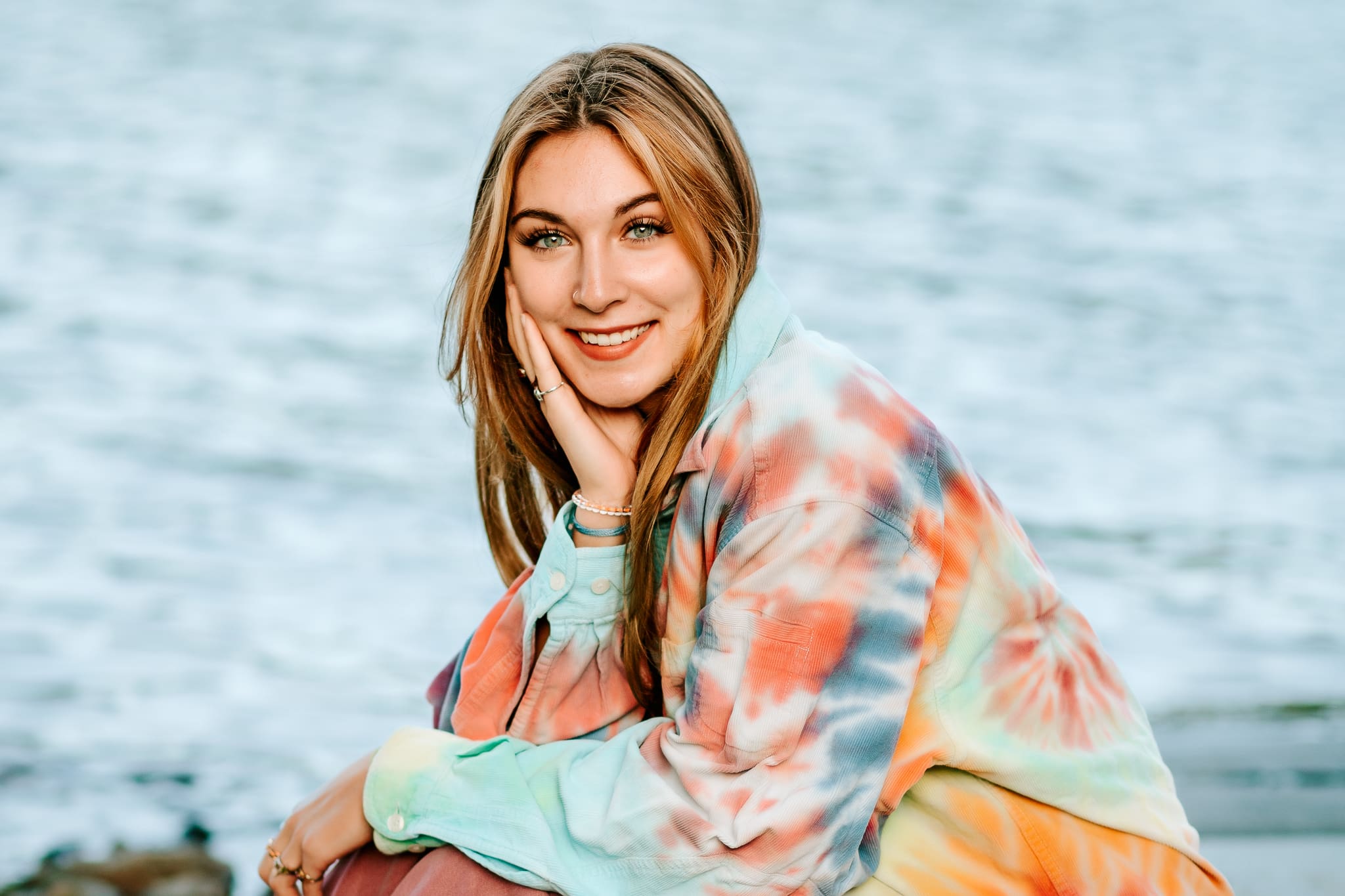 This high school senior is wearing a vibrant tie-dye top to bring out the pop in her senior photos. 