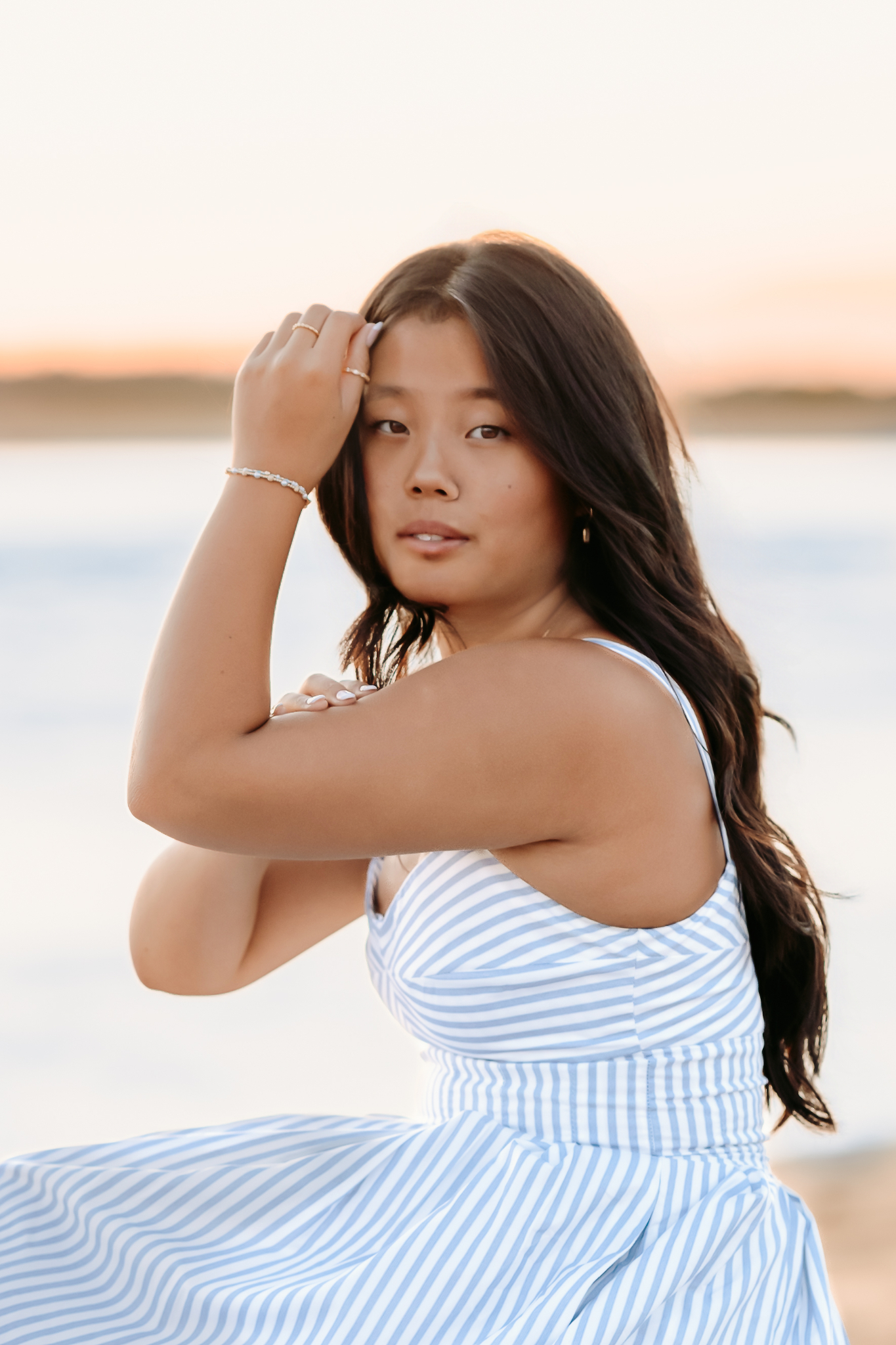 Senior girl posing seriously for her senior photos in Newburyport, MA