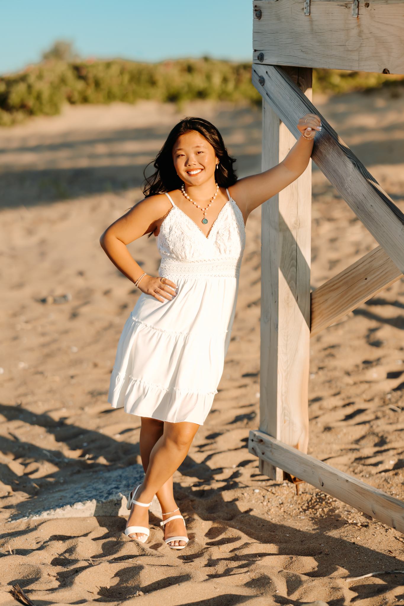 Senior high school girl posing on Plum Island, Newburyport, MA for her senior photos.