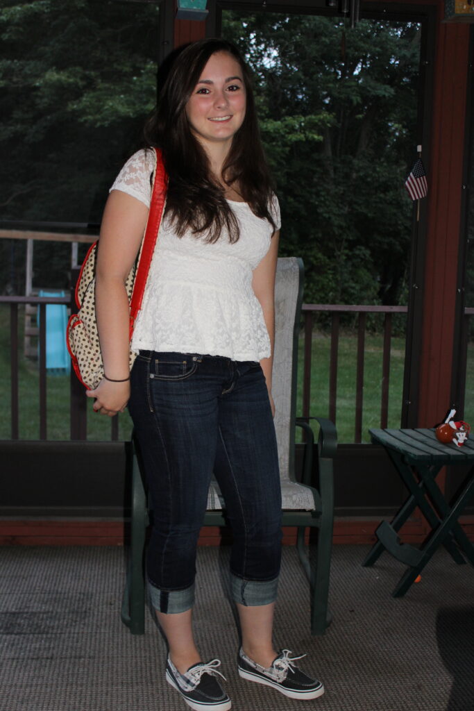 High school student posing for her traditional first-day-of-school photo