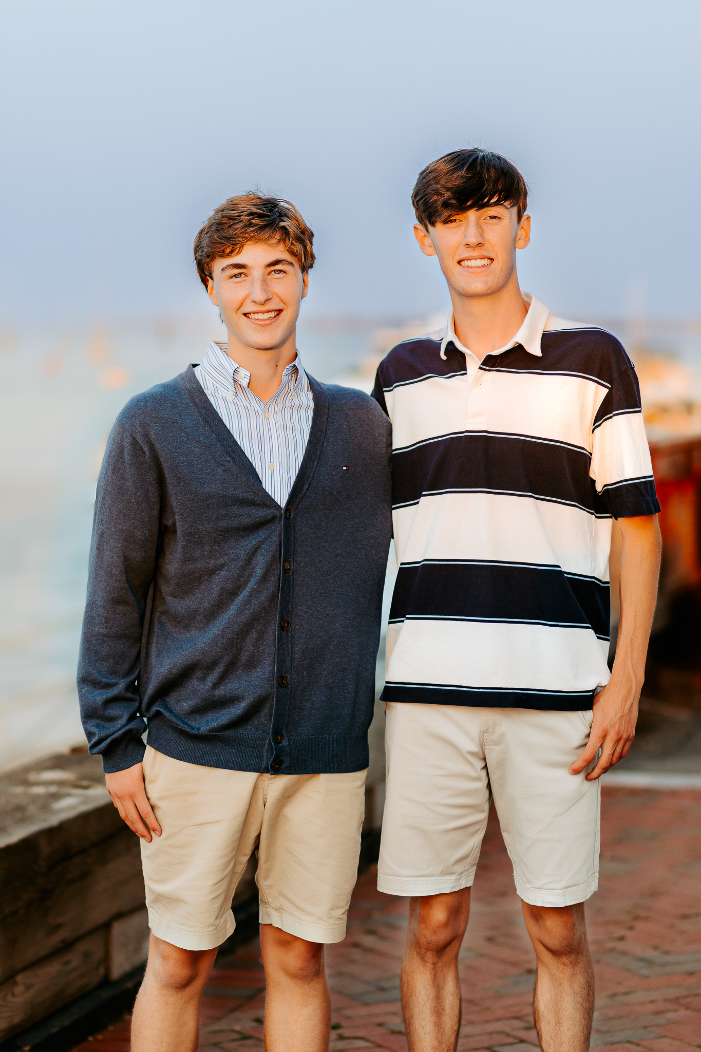High school senior twin brothers posing together during a senior photo session, Newburyport, MA