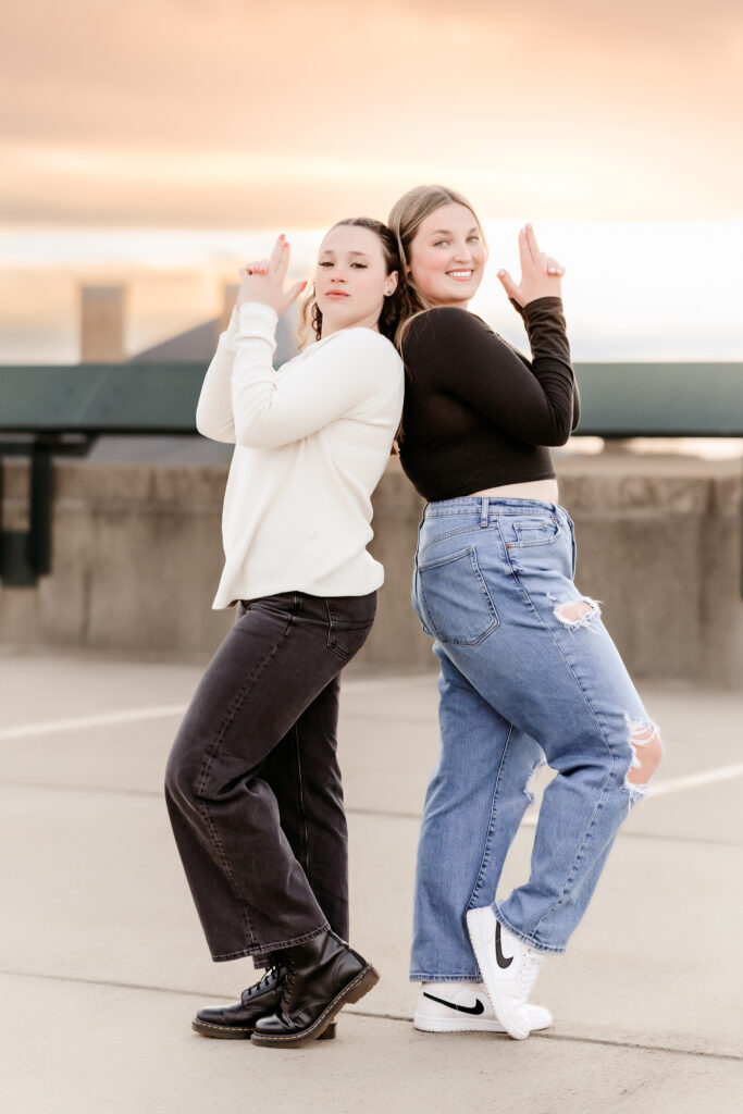 Two high school senior friends having fun together during their senior photo session, Lowell, MA